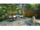 Stone patio with outdoor seating and fire pit at 15508 Possum Track Rd, Raleigh, NC 27614