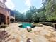 Resort-style pool and spa with a spacious flagstone patio at 15508 Possum Track Rd, Raleigh, NC 27614