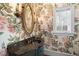 Elegant powder room with floral wallpaper, dark vanity, and gold mirror at 15508 Possum Track Rd, Raleigh, NC 27614