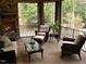 Cozy screened porch with fireplace and comfortable seating at 15508 Possum Track Rd, Raleigh, NC 27614
