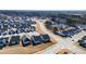 Aerial view of houses, roads, and a pond in a residential area at 1626 Plover Cir, Fuquay Varina, NC 27526