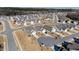 Aerial view of neighborhood with houses and streets at 1626 Plover Cir, Fuquay Varina, NC 27526