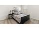 Cozy bedroom with a double bed, nightstands, and neutral color scheme at 1626 Plover Cir, Fuquay Varina, NC 27526