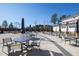 Relaxing community patio area with tables, chairs, and umbrellas at 1626 Plover Cir, Fuquay Varina, NC 27526