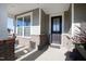 Dark brown front door with glass panes and brick accents at 1626 Plover Cir, Fuquay Varina, NC 27526