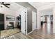 Open concept hallway with views into home office and living area at 1626 Plover Cir, Fuquay Varina, NC 27526