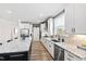 Clean kitchen with white cabinets, granite counters and stainless steel appliances at 1626 Plover Cir, Fuquay Varina, NC 27526