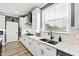 Modern kitchen features white cabinets and a double sink at 1626 Plover Cir, Fuquay Varina, NC 27526