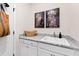 Laundry room with utility sink and granite countertop at 1626 Plover Cir, Fuquay Varina, NC 27526