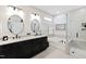 Modern bathroom with double vanity, soaking tub, and glass shower at 1626 Plover Cir, Fuquay Varina, NC 27526