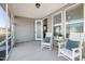 Relaxing screened porch with rocking chairs and backyard access at 1626 Plover Cir, Fuquay Varina, NC 27526