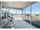 Screened porch with rocking chairs and neighborhood view at 1626 Plover Cir, Fuquay Varina, NC 27526