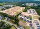 Aerial view of a community with new homes, tree coverage, and green spaces at 1705 Clydner Dr, Cary, NC 27523