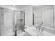 Elegant bathroom with a glass-enclosed shower featuring decorative tile and a quartz vanity at 1705 Clydner Dr, Cary, NC 27523