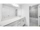 Bright bathroom featuring a dual sink vanity with quartz countertop and decorative lighting at 1705 Clydner Dr, Cary, NC 27523
