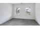 Bright bedroom with neutral carpeting and natural light streaming through the windows at 1705 Clydner Dr, Cary, NC 27523