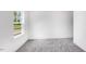 Bright bedroom featuring gray carpet and white walls at 1705 Clydner Dr, Cary, NC 27523