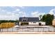 New community pool area surrounded by a fence, with covered seating and a bath house at 1705 Clydner Dr, Cary, NC 27523