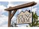 New home community signage 'Young Farm' against a blue sky, creating an inviting atmosphere at 1705 Clydner Dr, Cary, NC 27523
