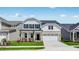 Charming two-story home featuring a well-manicured lawn and a welcoming front porch at 1705 Clydner Dr, Cary, NC 27523