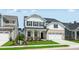 Charming two-story home with a well-manicured lawn, a brick facade, and an attached two-car garage at 1705 Clydner Dr, Cary, NC 27523