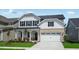 A beautiful two-story home with a well-kept lawn, a two-car garage, and a welcoming front porch at 1705 Clydner Dr, Cary, NC 27523
