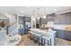 Modern kitchen with gray cabinets, white countertop island, and stainless steel appliances at 1705 Clydner Dr, Cary, NC 27523