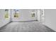 Spacious main bedroom with plush carpeting, multiple windows, and an en-suite bathroom at 1705 Clydner Dr, Cary, NC 27523