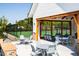 Outdoor entertaining space with tables, seating and tennis court views at 1705 Clydner Dr, Cary, NC 27523