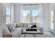 Sunroom with a comfortable sectional sofa and plenty of natural light at 1705 Clydner Dr, Cary, NC 27523