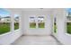 Inviting sunroom with large windows offering panoramic views of the backyard at 1705 Clydner Dr, Cary, NC 27523