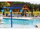 Community pool with water features and lounge chairs at 1705 Clydner Dr, Cary, NC 27523