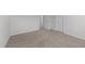 Simple bedroom with carpet flooring and two closets at 20 Windflower Ct, Clayton, NC 27520