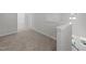 Upstairs hallway with carpet and access to bathroom at 20 Windflower Ct, Clayton, NC 27520