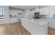 Open concept kitchen featuring white cabinets and quartz countertops at 20 Windflower Ct, Clayton, NC 27520