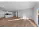 Open concept living room with hardwood floors and access to kitchen at 20 Windflower Ct, Clayton, NC 27520