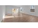Bright living room with hardwood floors and sliding glass doors at 20 Windflower Ct, Clayton, NC 27520