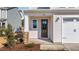 Inviting front entrance features a stylish brown door and stone pillar accents for added curb appeal at 20 Windflower Ct # Homesite 5, Clayton, NC 27520