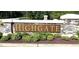 The Highgate neighborhood sign welcomes residents with its stone and lush landscaping at 20 Windflower Ct # Homesite 5, Clayton, NC 27520
