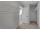 Spacious walk-in closet with ample shelving for storage and organization in neutral color palette at 20 Windflower Ct # Homesite 5, Clayton, NC 27520