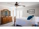 Bright bedroom with wood furniture and access to balcony at 2018 Edgewood Ave, Burlington, NC 27215