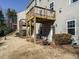Backyard with a wooden deck overlooking the yard and fire pit at 222 Kylemore Cir, Cary, NC 27513