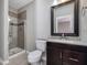 Bathroom with shower, toilet, and dark brown vanity at 222 Kylemore Cir, Cary, NC 27513