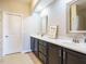 Double vanity bathroom with dark brown cabinets at 222 Kylemore Cir, Cary, NC 27513