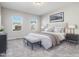 Spacious bedroom with two windows and plush carpet at 222 Kylemore Cir, Cary, NC 27513