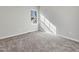 Well-lit bedroom featuring carpet, a window, and neutral wall colors at 222 Kylemore Cir, Cary, NC 27513