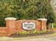 Attractive Ardmore at Reedy Creek brick sign with flowers and manicured landscaping at 222 Kylemore Cir, Cary, NC 27513