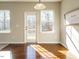 Bright dining area with hardwood floors and access to deck at 222 Kylemore Cir, Cary, NC 27513
