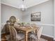 Farmhouse-style dining room with wooden table and chairs at 222 Kylemore Cir, Cary, NC 27513