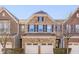 Charming brick townhome with a two-car garage and attractive front facade at 222 Kylemore Cir, Cary, NC 27513